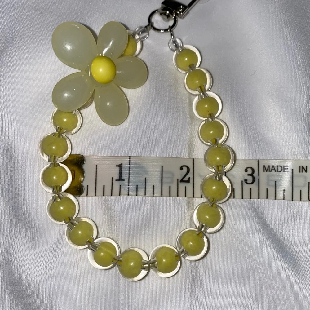 1-wrist lanyard for cells, keys and more Yellow Oversized Flower Charm